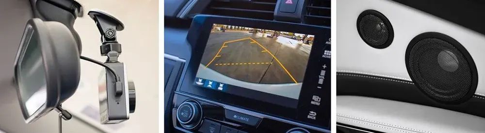Car dashboard with touchscreen navigation and two speakers on the passenger-side dashboard