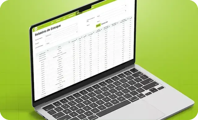 Laptop prateado exibindo uma planilha sobre um fundo verde brilhante.