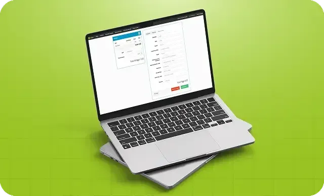 Laptop prateado exibindo uma planilha sobre um fundo verde brilhante.