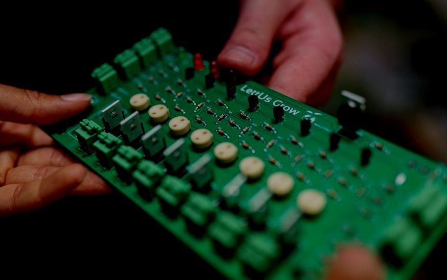 Engineer holding an electronic prototype
