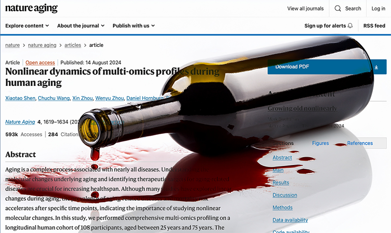 Omgevallen fles wijn op een artikel over een wetenschappelijk onderzoek van Stanford.