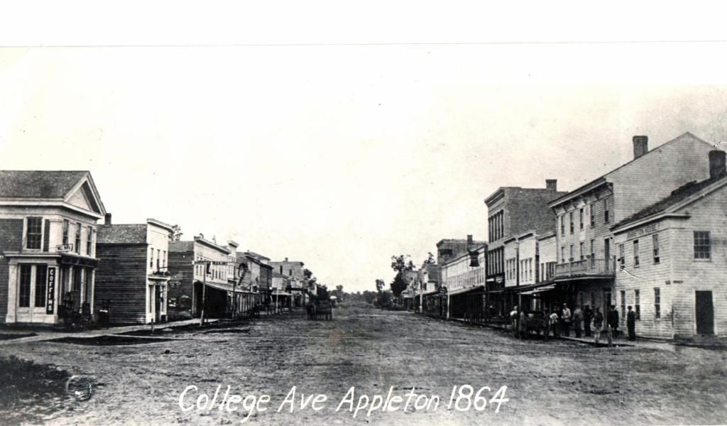 Historic black-and-white street view of College Ave. in Appleton, 1864, with buildings lining both sides of the road