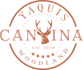 A logo for yaquis cantina woodland with a deer on it