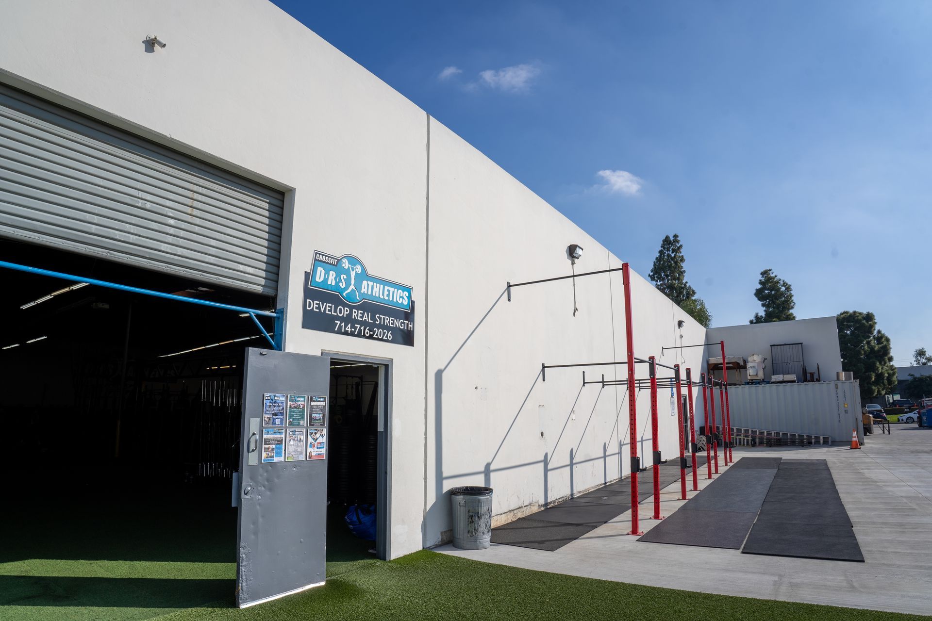 The outside of a gym with a sign that says ' agility ' on it.