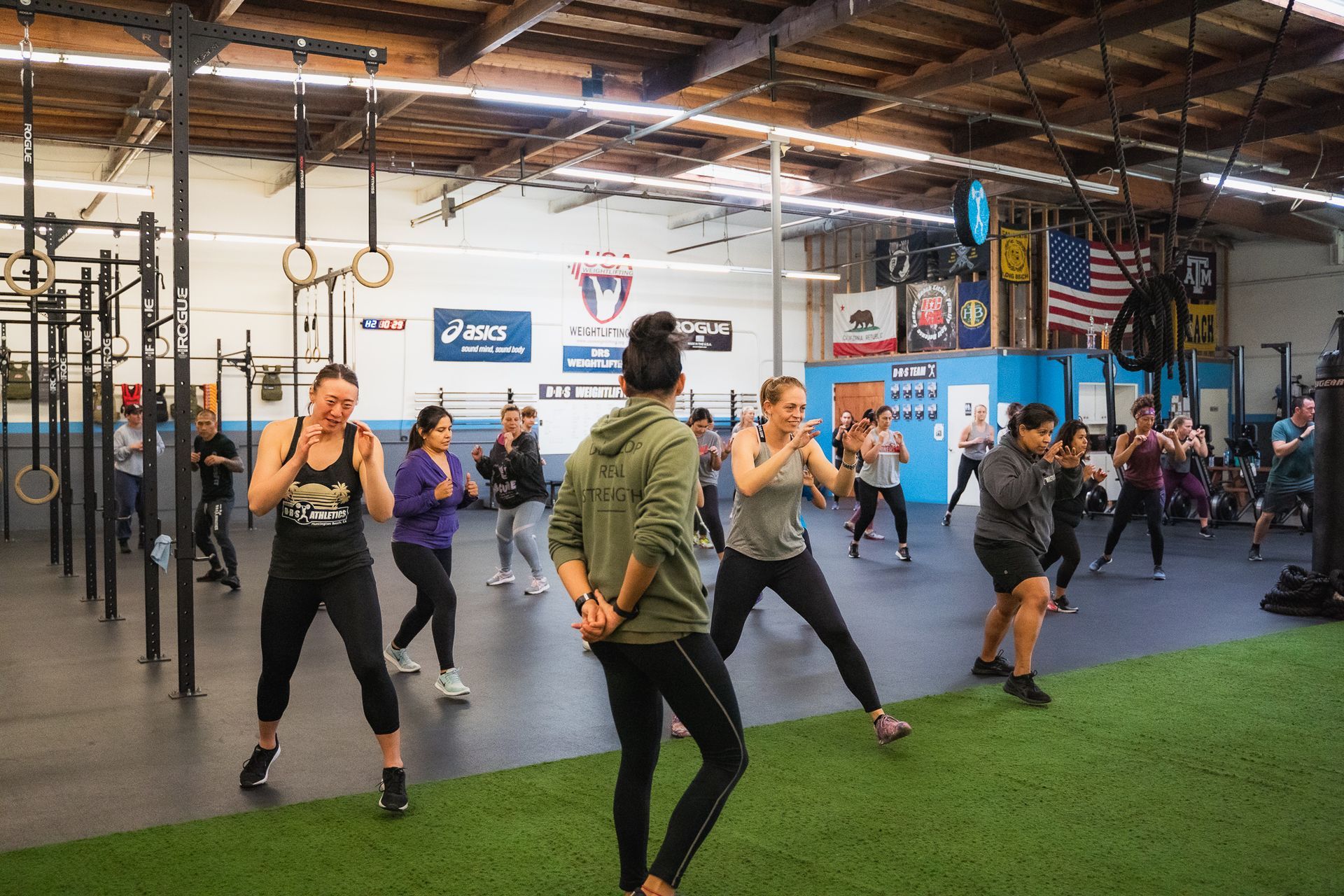 A group of people are boxing in a gym.