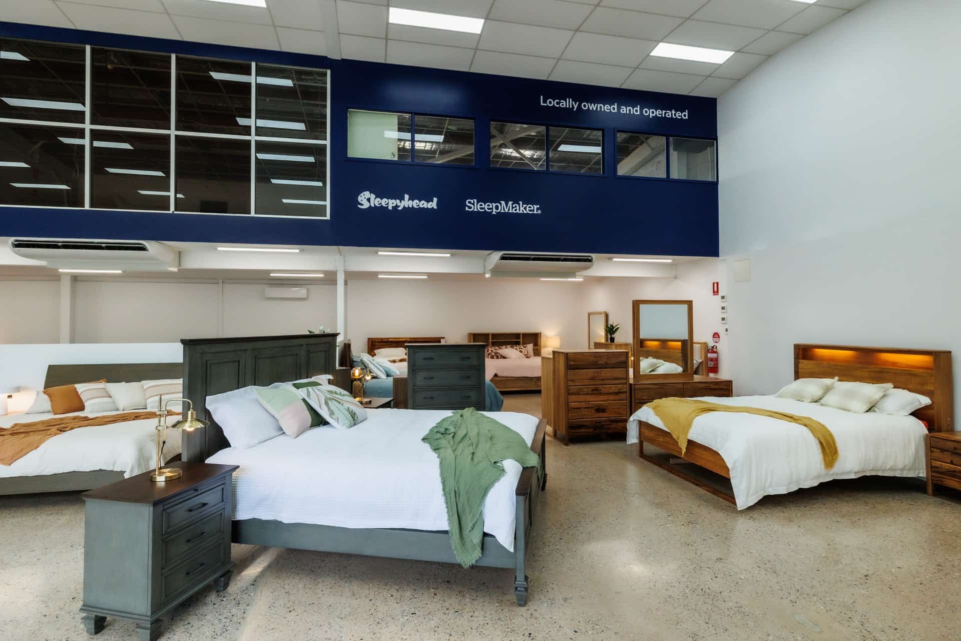 A show room with beds and bedside tables on display — The Comfort Zone Darwin In Winnellie, NT