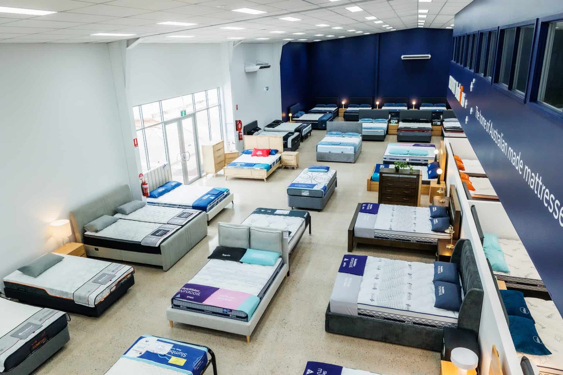 A Large Room Filled With Lots of Beds in a Store — The Comfort Zone Darwin In Darwin, NT