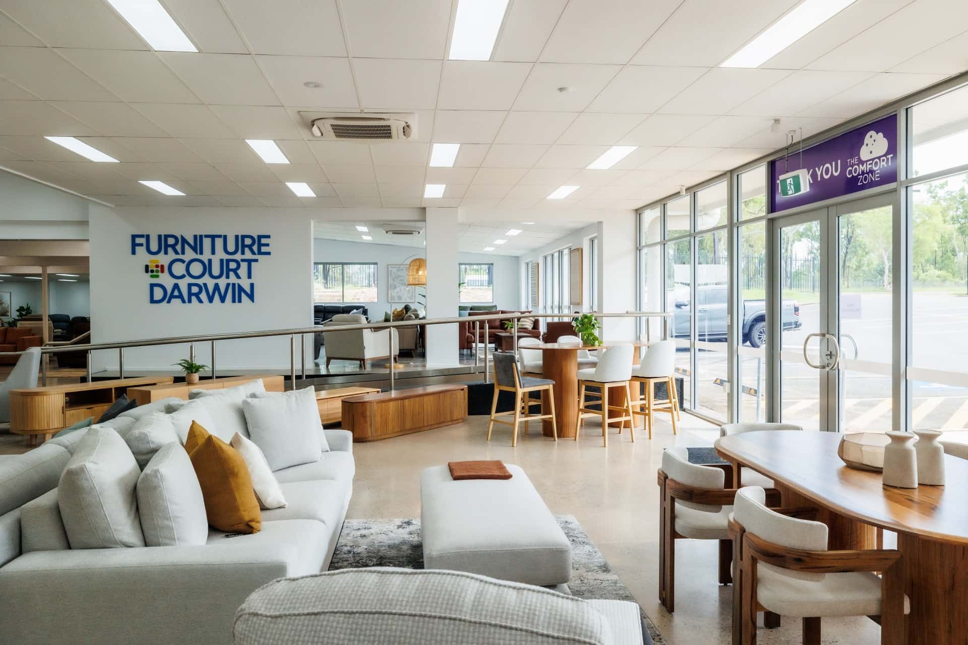 A furniture show room with dining tables and couches on display — The Comfort Zone Darwin In Winnellie, NT