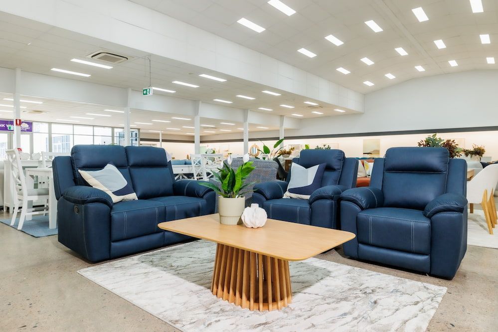 A Living Room Filled With Furniture and a Coffee Table — The Comfort Zone Darwin In Winnellie, NT