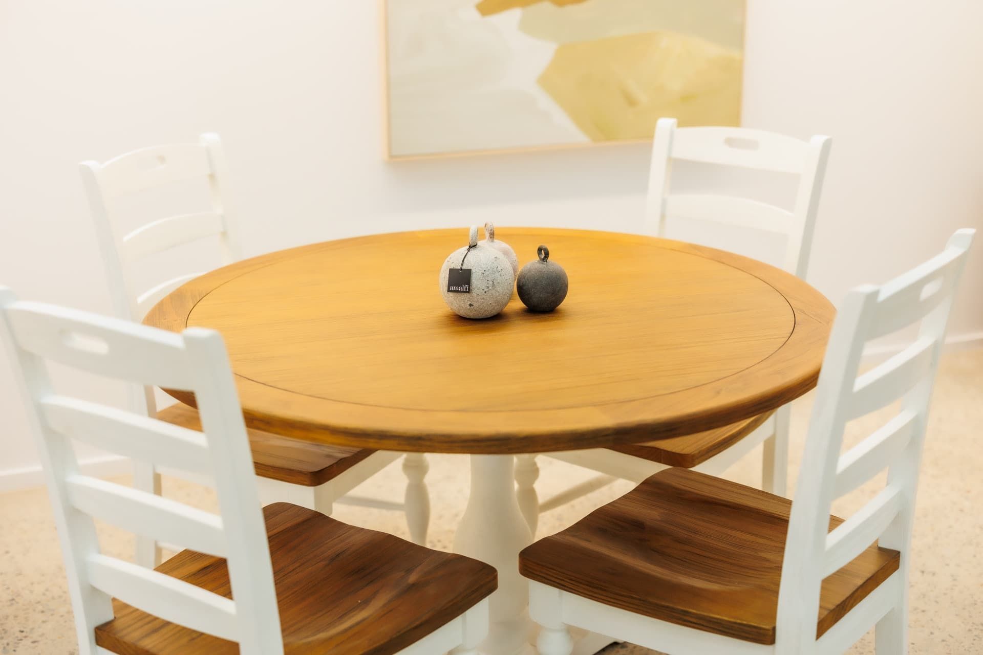 A Dining Room Table With Four Chairs and a Vase on It — The Comfort Zone Darwin In Winnellie, NT