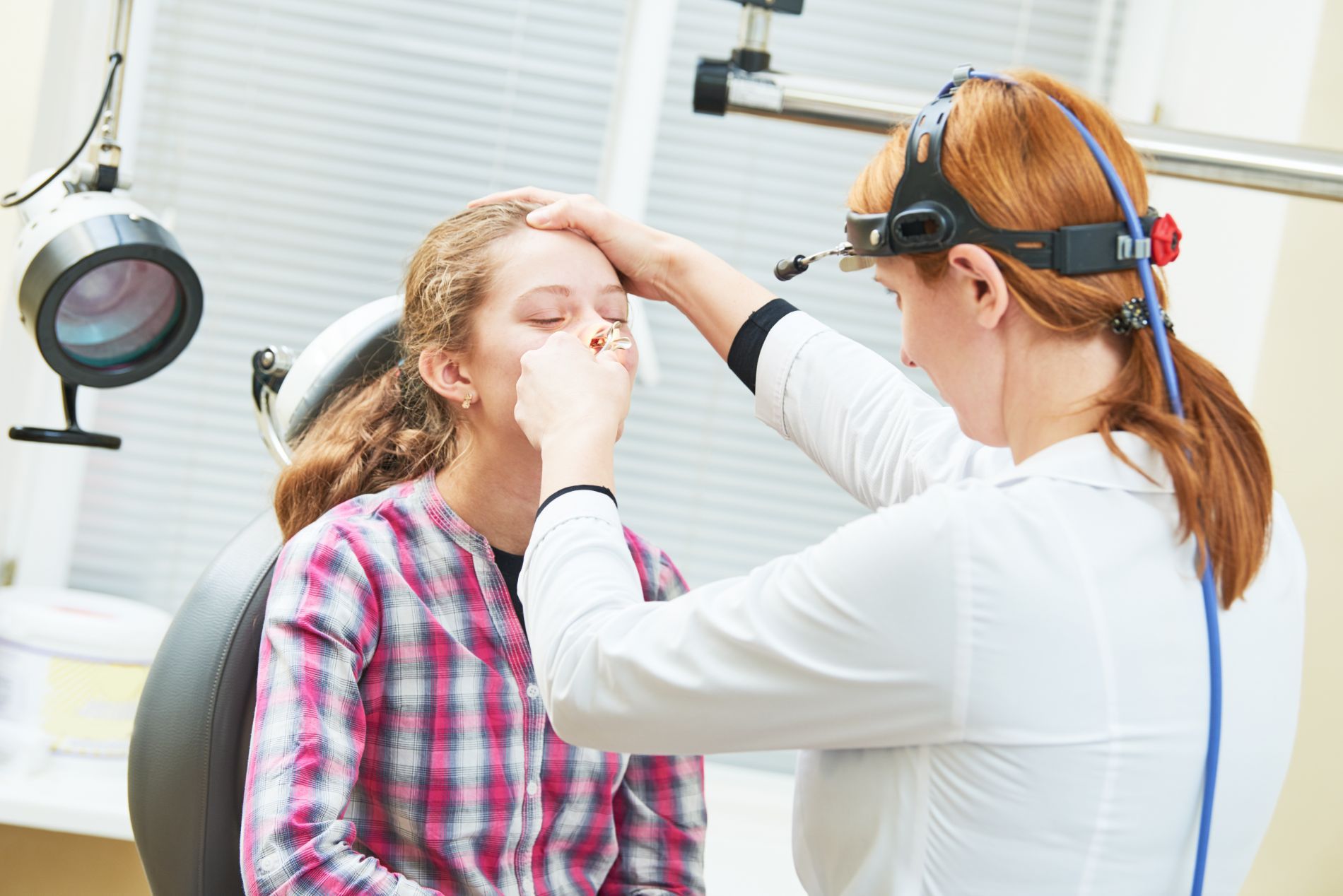 A person getting a nose examination
