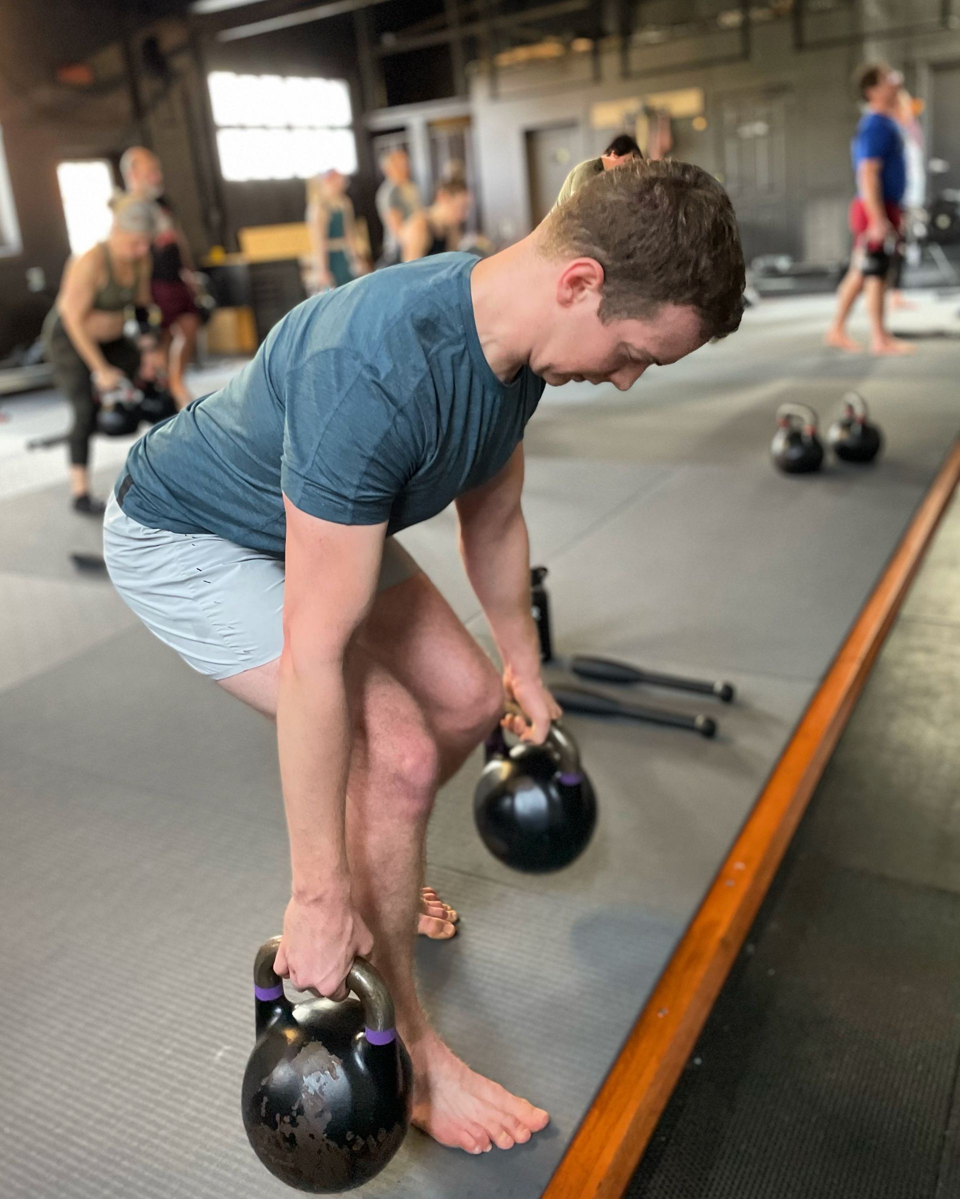 Coach-led group training at Soma MVMT in Maplewood, NJ building strength.