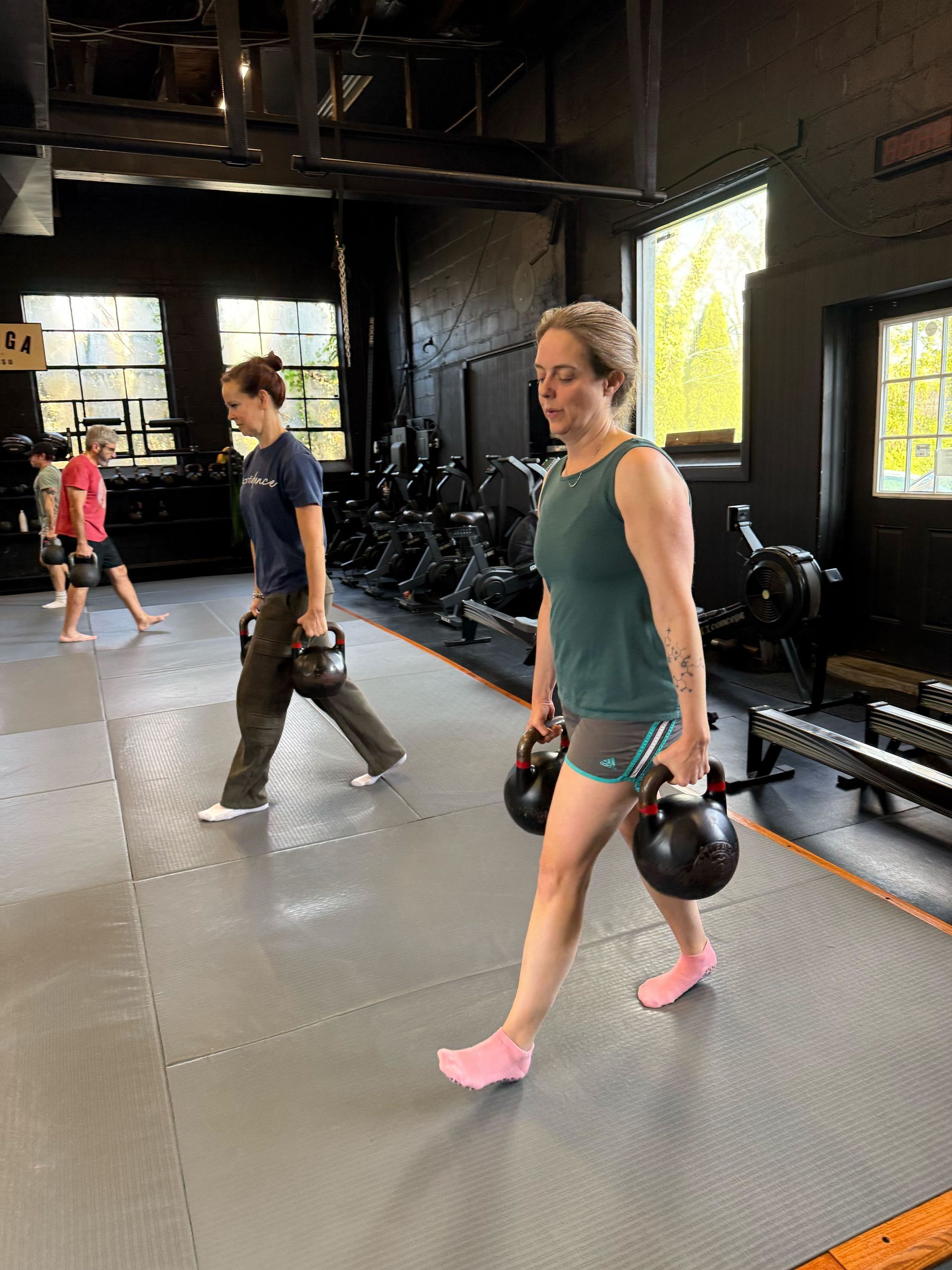 Members training in a coached small group fitness class at Soma MVMT in Maplewood, NJ for strength and stamina.
