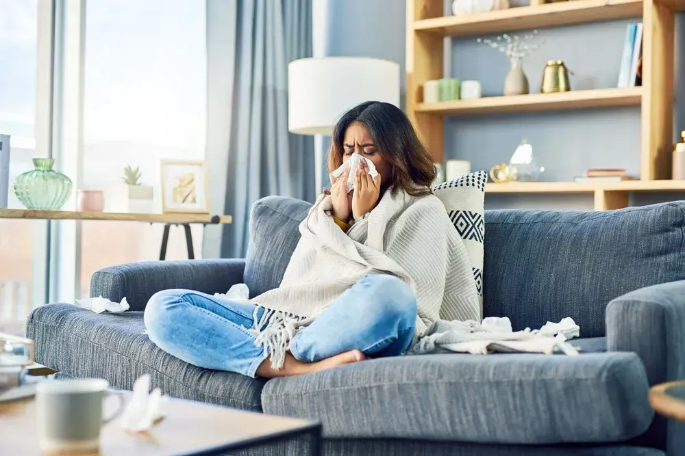Woman sneezing