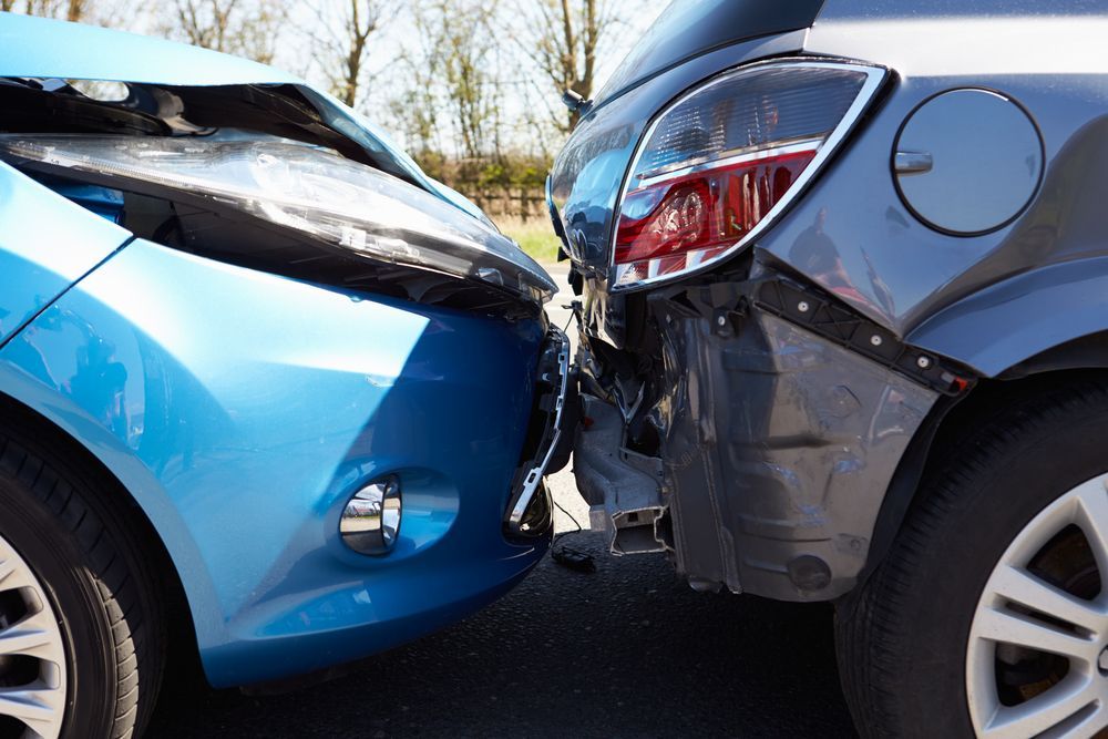 Two Cars, Blue and Grey, in a Head-on Collision — Supalook Smash Repairs In Port Macquarie, NSW