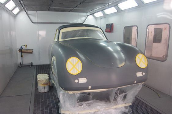 Grey Porsche Car Inside a Paint Booth With Taped-off Headlights and Windows — Supalook Smash Repairs In Port Macquarie, NSW