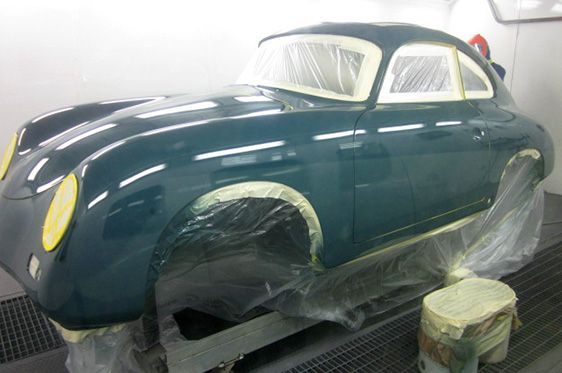 A Teal Vintage Sports Car Body Undergoing Painting in a Workshop — Supalook Smash Repairs In Port Macquarie, NSW