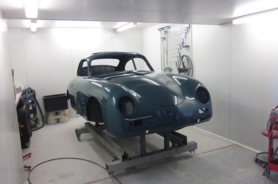 Teal Classic Car Body on a Lift in a Paint Booth — Supalook Smash Repairs In Port Macquarie, NSW