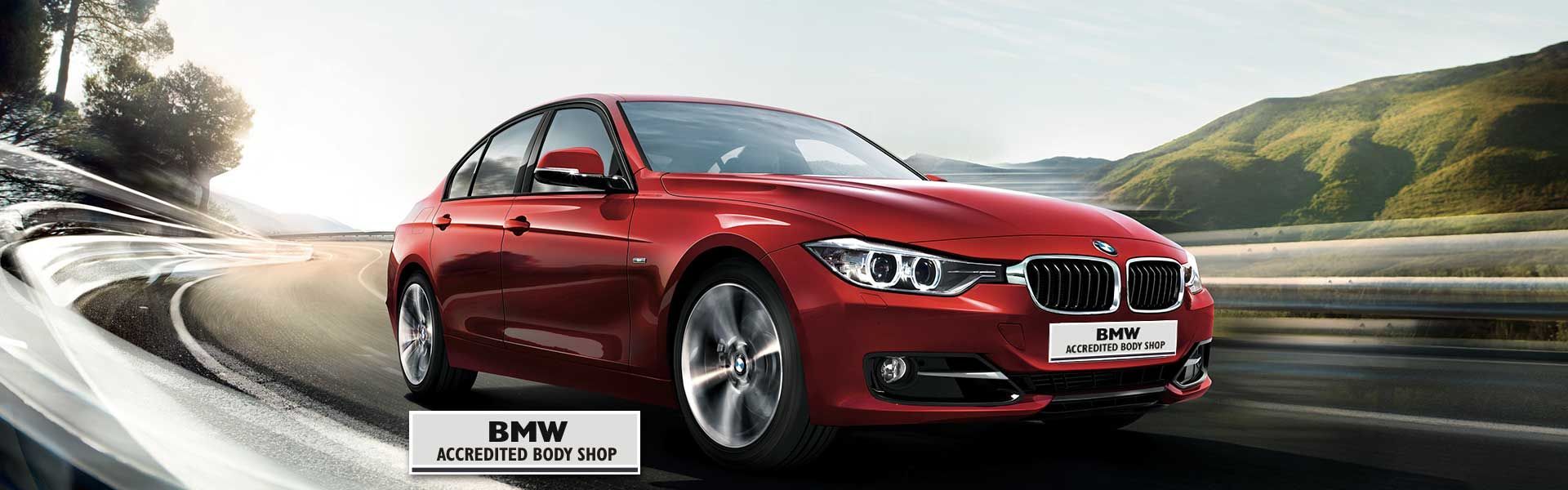 Red BMW Car Driving on a Curved Road — Supalook Smash Repairs In Port Macquarie, NSW