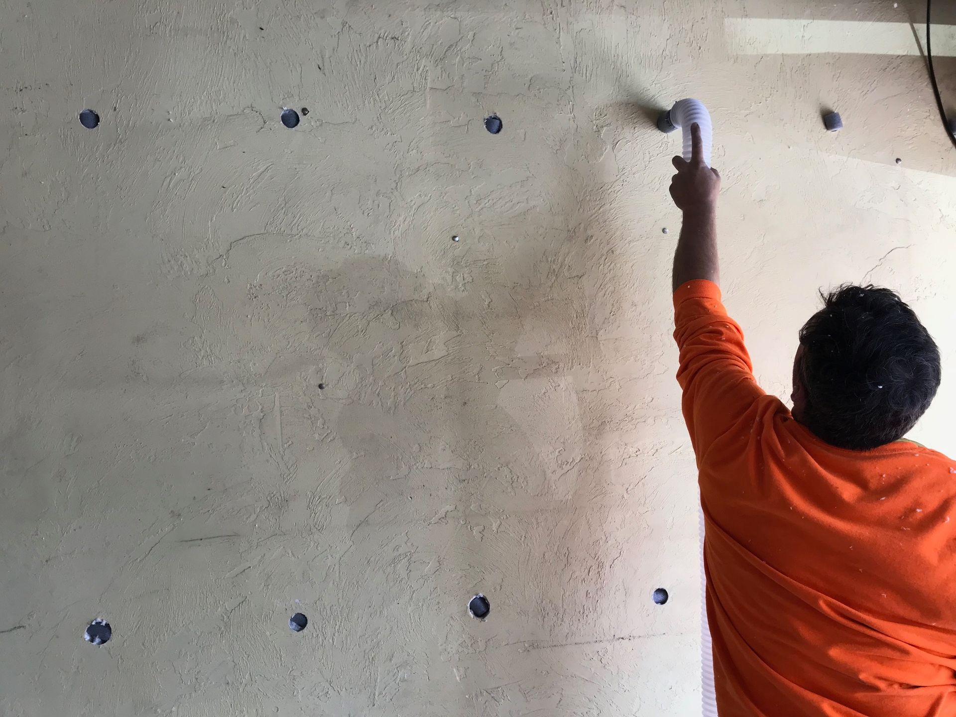 applying insulation pads to walls