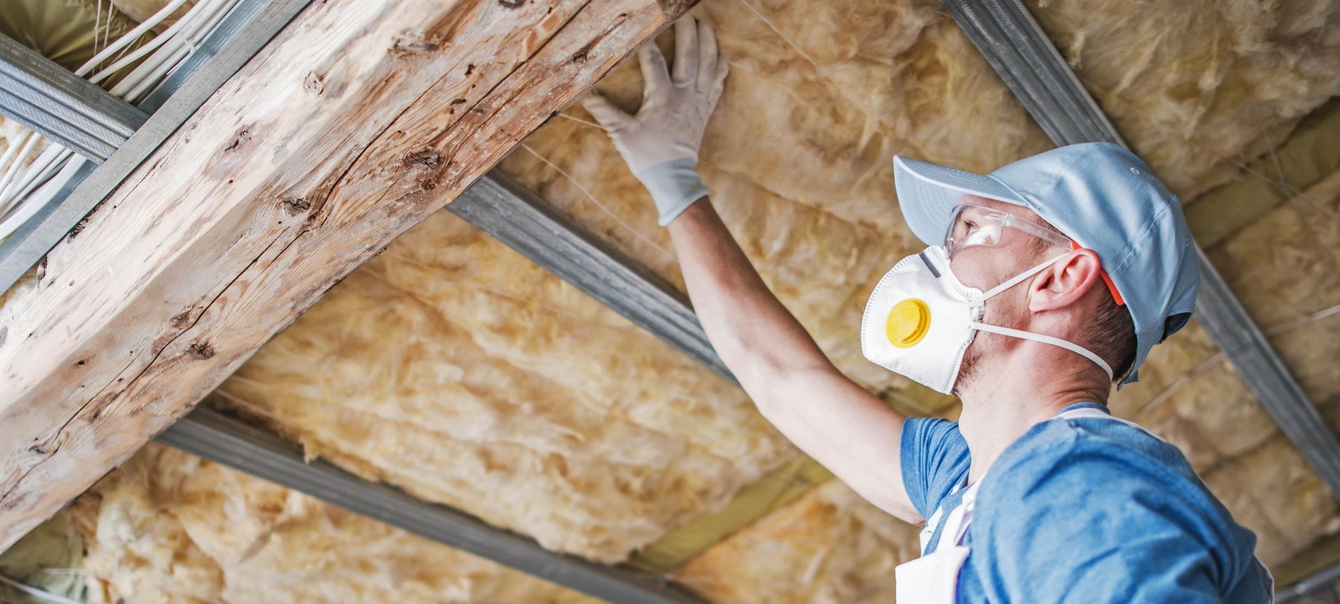 worker insulates the wall