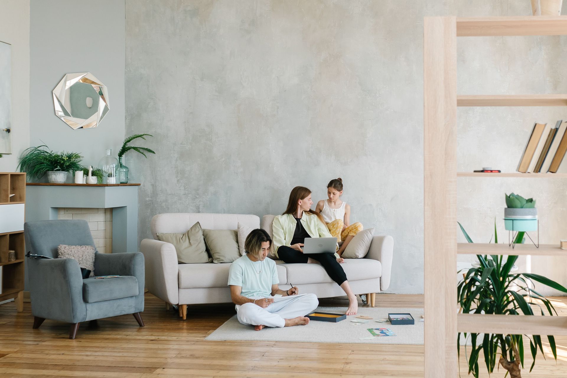 Family relaxing in a professionally managed rental home living room - ARCH Property Management for tenants