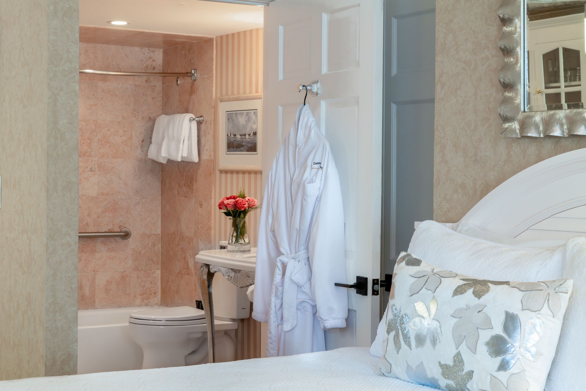 A hotel room with a bed and a bathroom