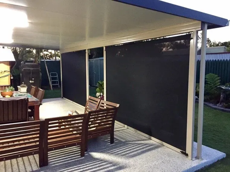 A Patio With A Table And Chairs Under A Canopy — Affordable Screens & Blinds in Thabeban, QLD