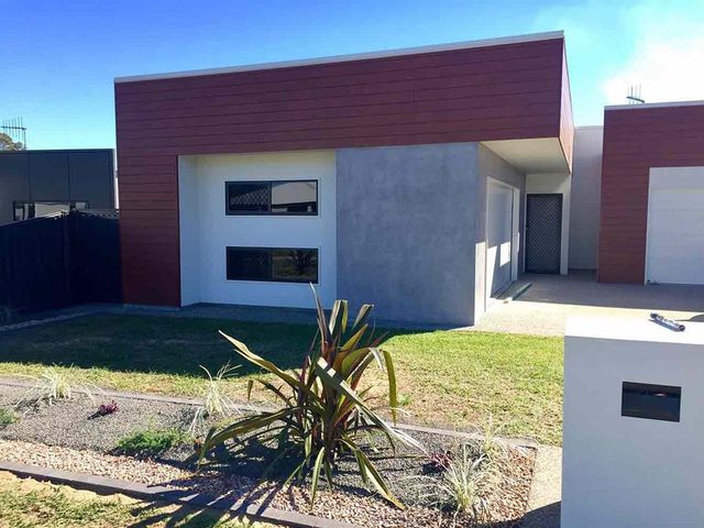 A House With A Lot Of Windows And A Mailbox In Front Of It — Affordable Screens & Blinds in Thabeban, QLD