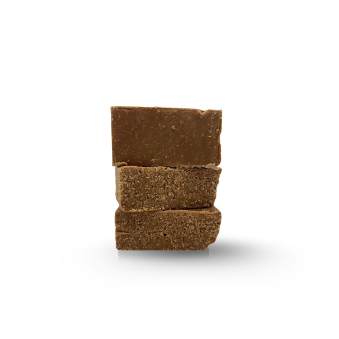 Three stacked, brown bouillon cubes.