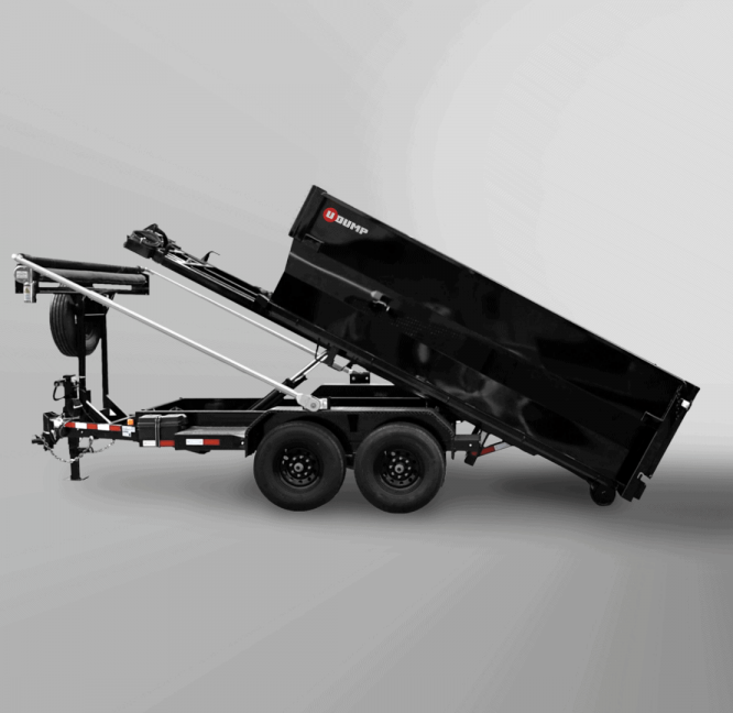 Yellow skid steer clears dirt and debris in a wooded area, kicking up dust.