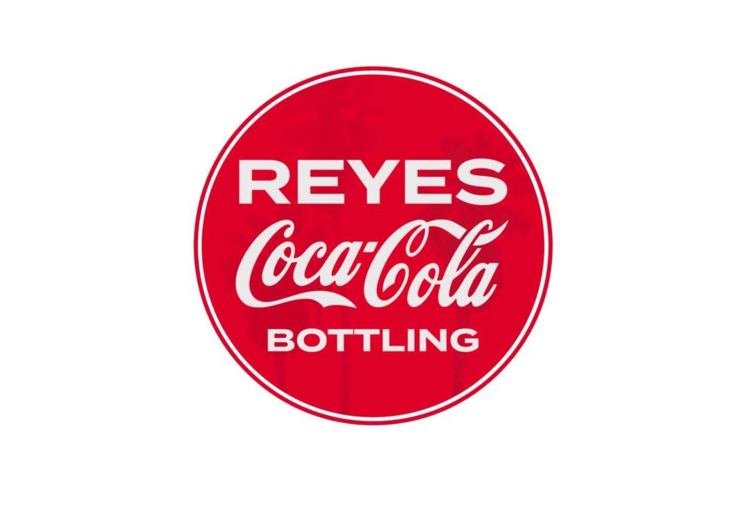 Reyes Coca-Cola Bottling logo: white text on a red circle.
