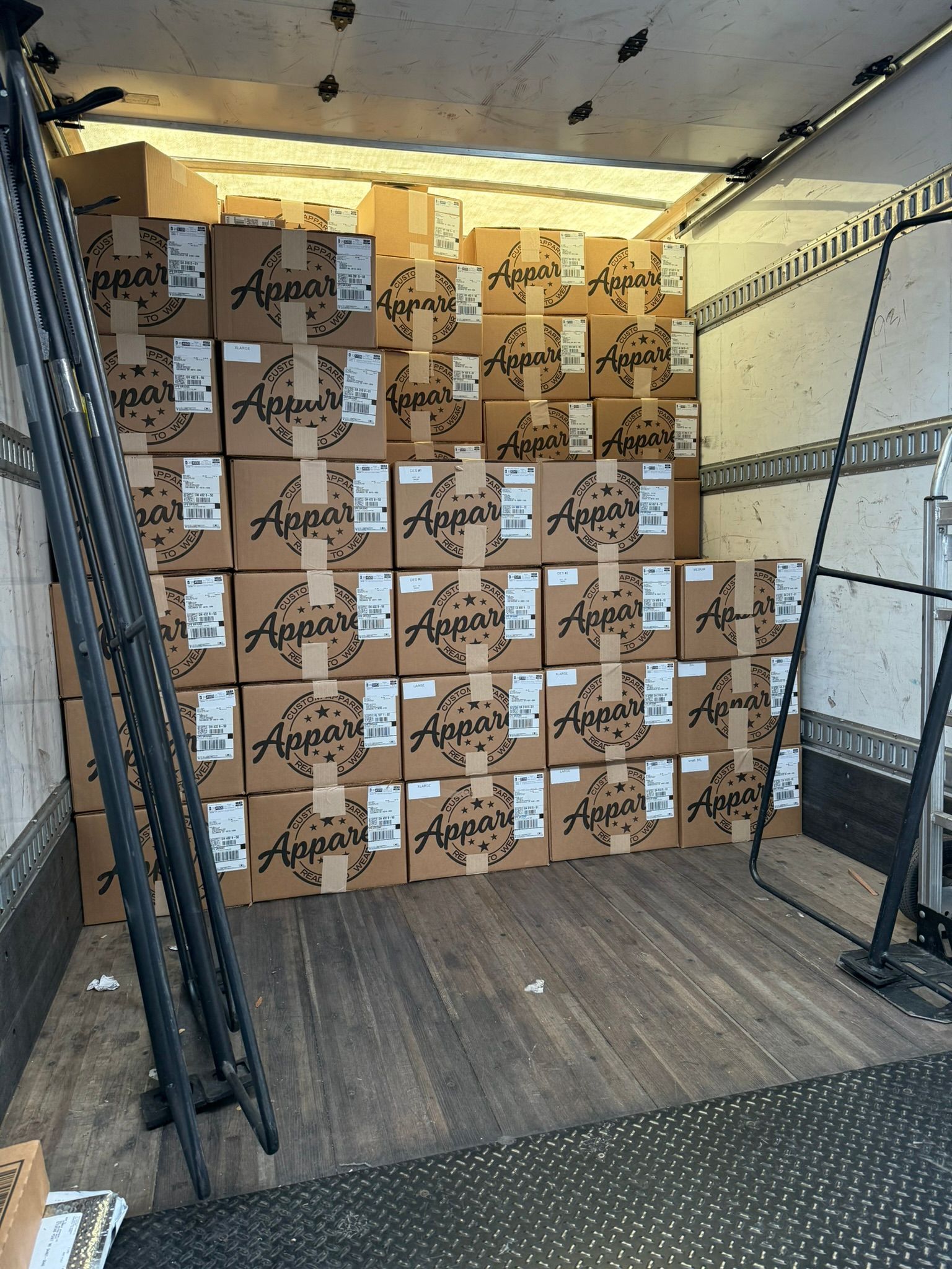 UPS truck loaded with HTG branded apparel shipping boxes