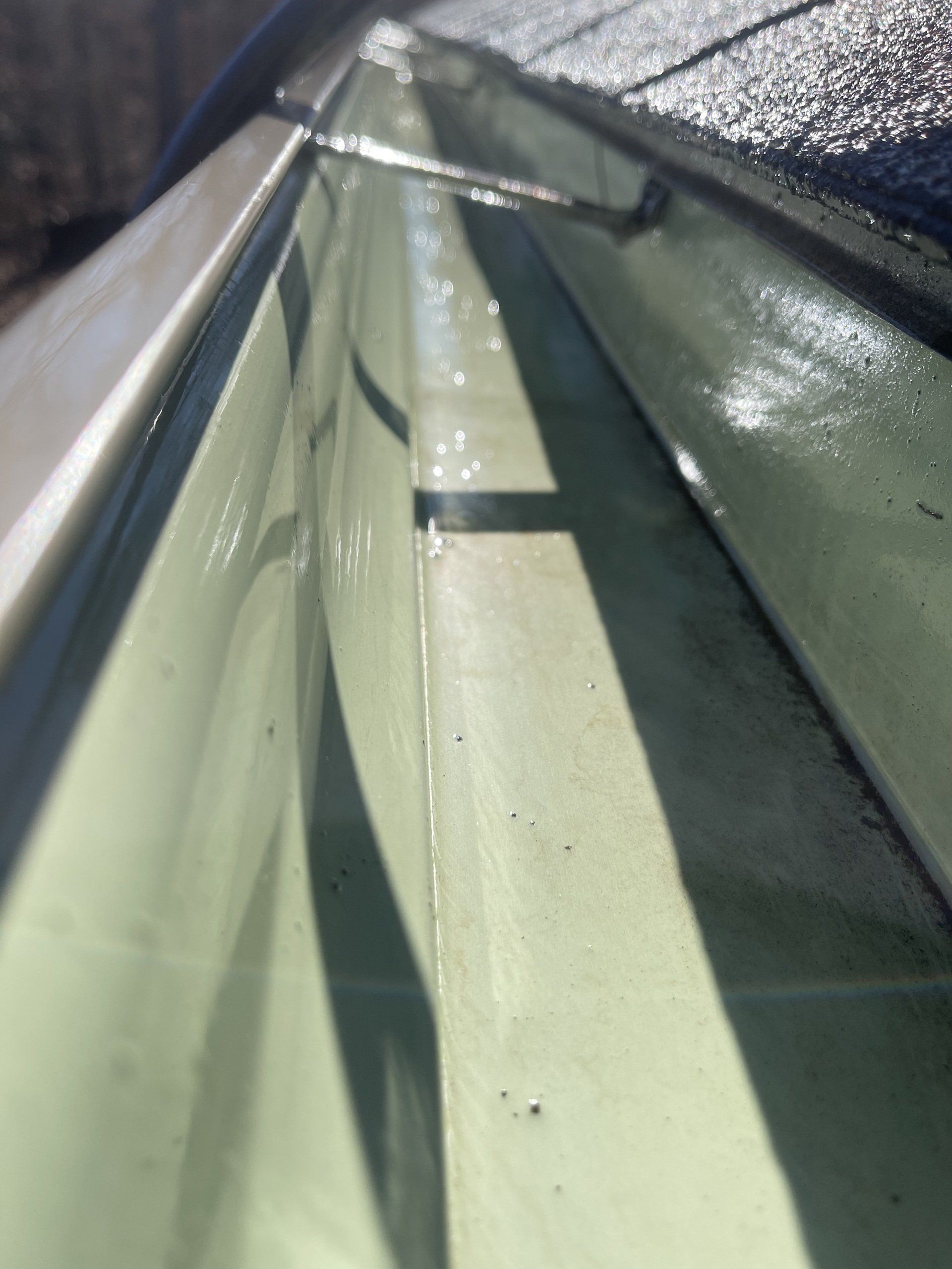 clean pressured washed gutters in a residential home in NWA