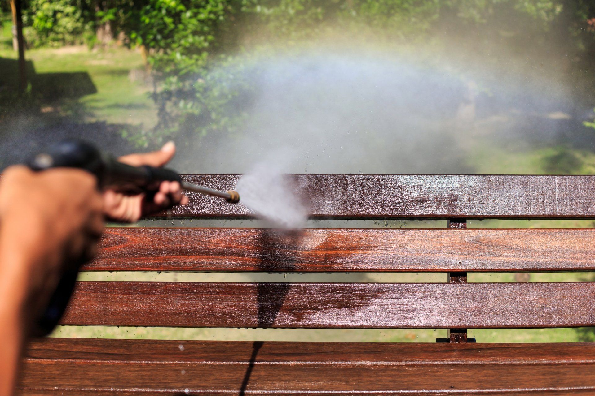 power washing company pressure washing bench in public park