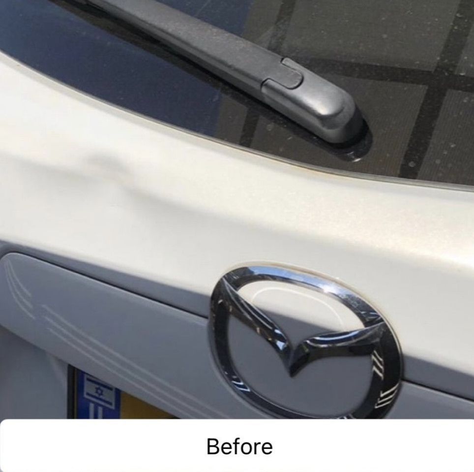 Close-up of a silver Mazda rear emblem and windshield wiper on a car, labeled “Before”