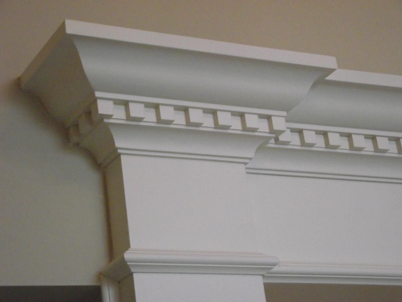 A close up of a white molding on a wall