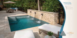 Modern backyard pool with stone wall, patio seating, and trees in the background