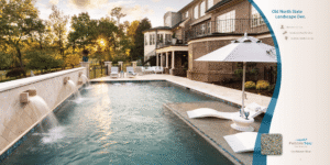 Luxury outdoor hotel pool beside a modern building, with lounge chairs and trees at sunset