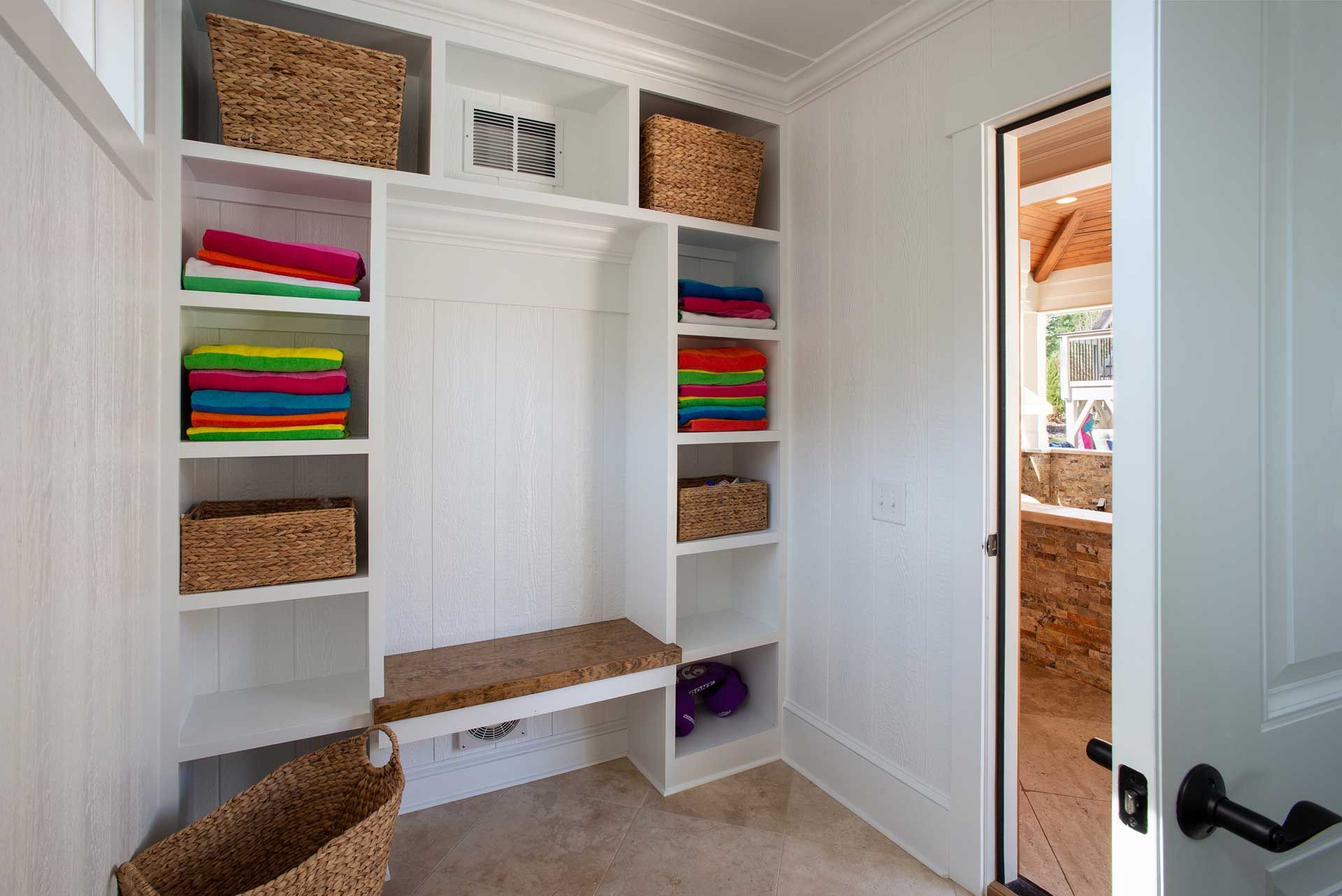  closet with colorful folded clothes