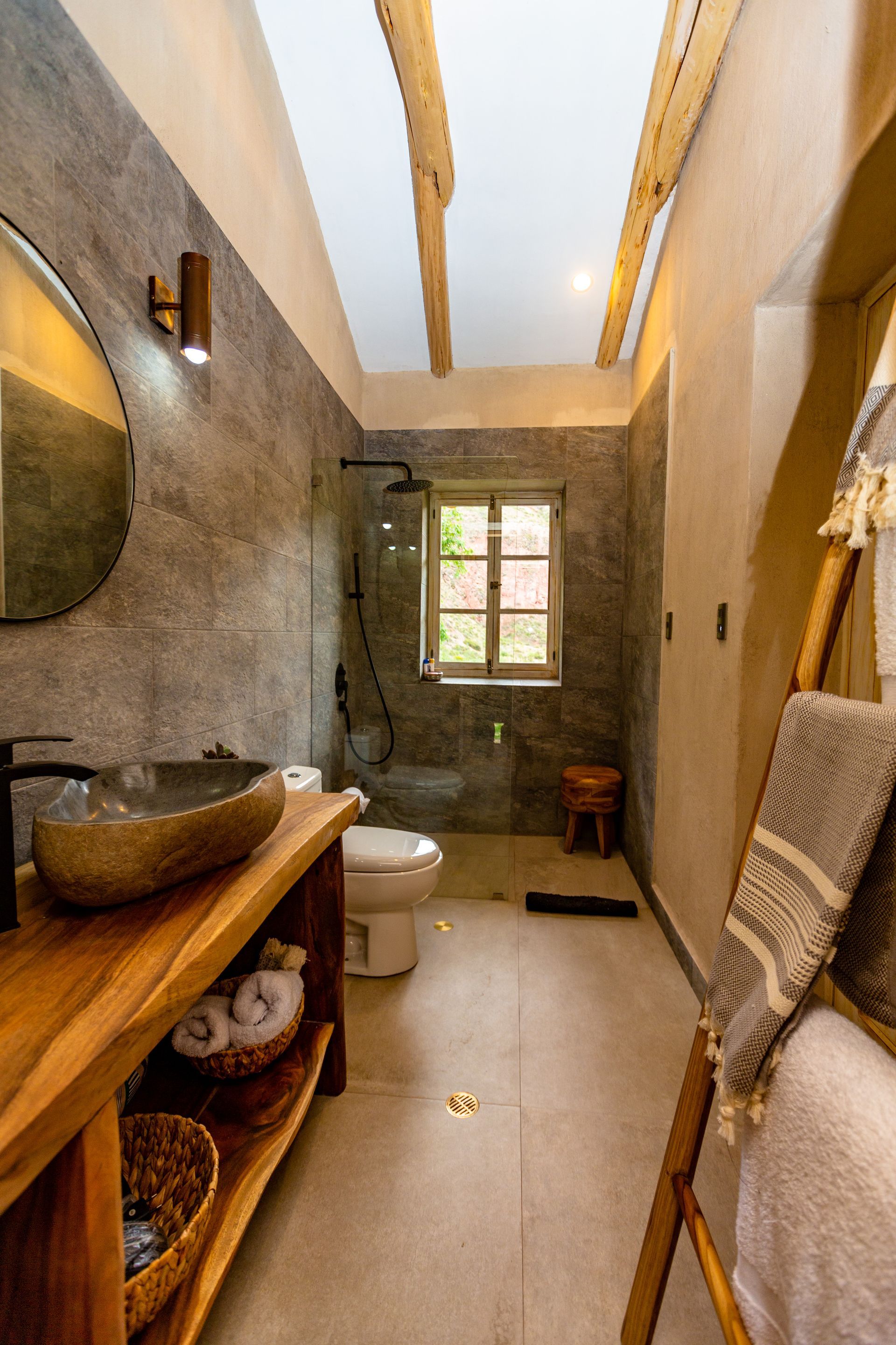 A bathroom with a sink , toilet , and mirror.