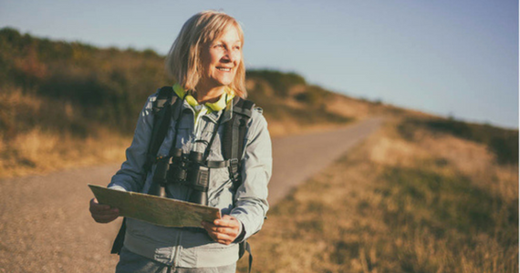 Woman Hiking Outdoors, Holding Map — Midcoast Financial Planning Group in Tuncurry, NSW