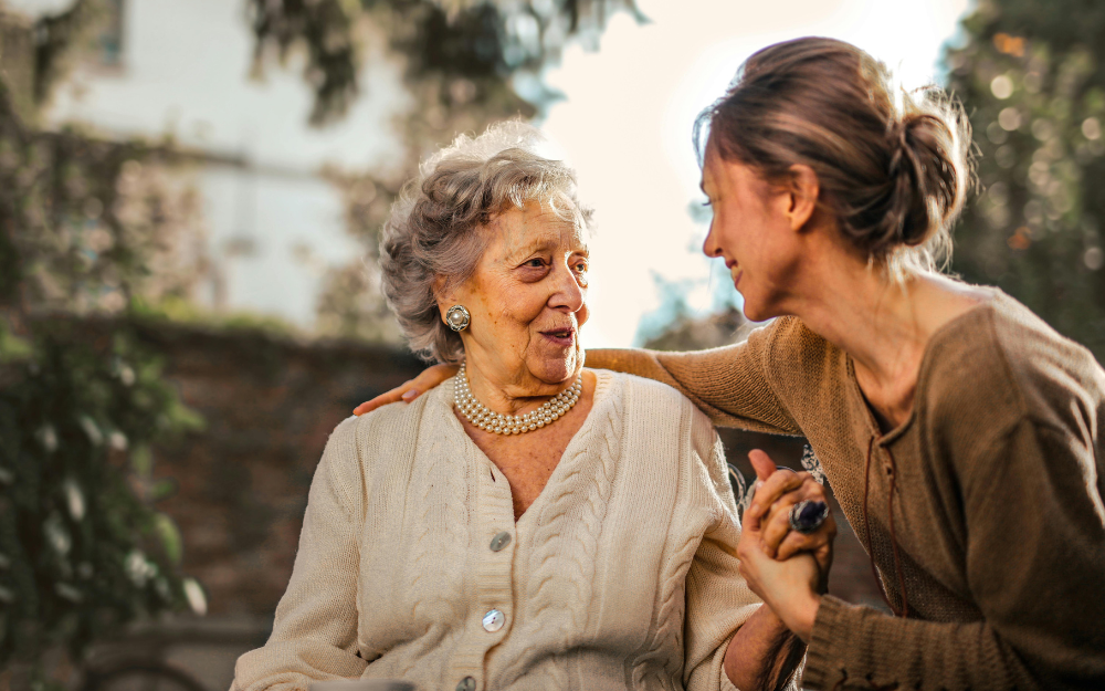 Woman Supporting an Elderly Person — Midcoast Financial Planning Group in Tuncurry, NSW