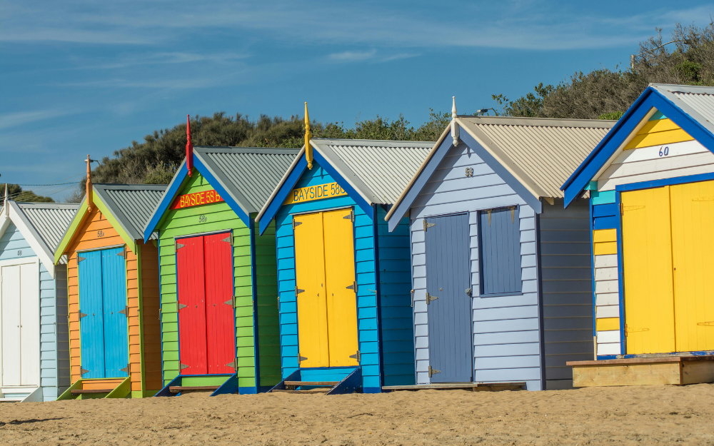 Row of Colorful Beach Huts — Midcoast Financial Planning Group in Tuncurry, NSW