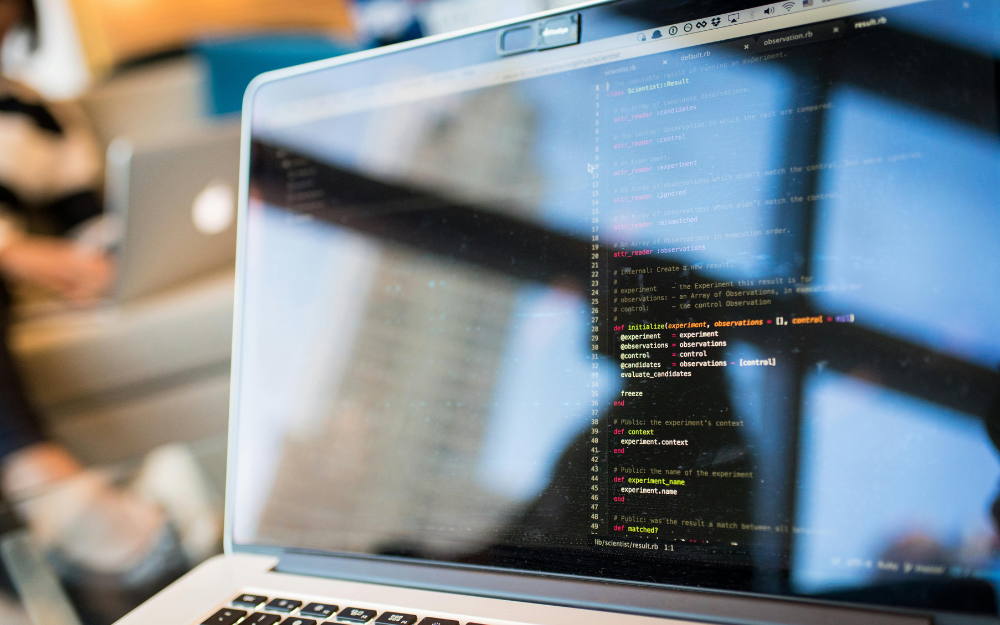 Laptop Screen Displaying Code — Midcoast Financial Planning Group in Tuncurry, NSW