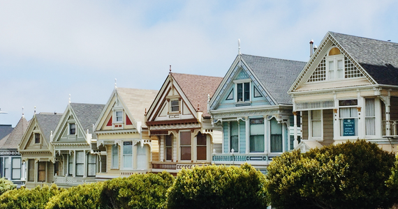 Row of colorful Victorian houses with manicured hedges  — Midcoast Financial Planning Group in Tuncurry, NSW