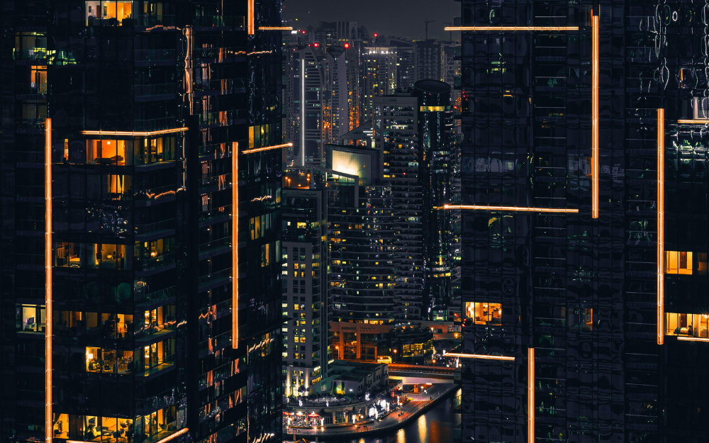 Night View of Illuminated City Skyscrapers — Midcoast Financial Planning Group in Tuncurry, NSW