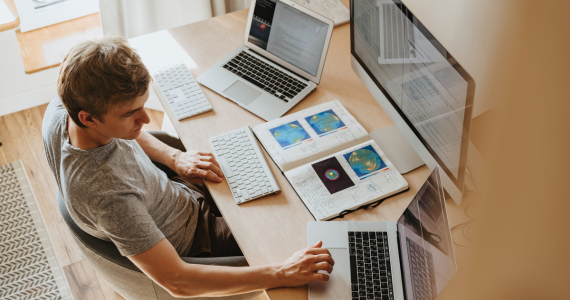 A Person Working at A Desk — Midcoast Financial Planning Group in Tuncurry, NSW
