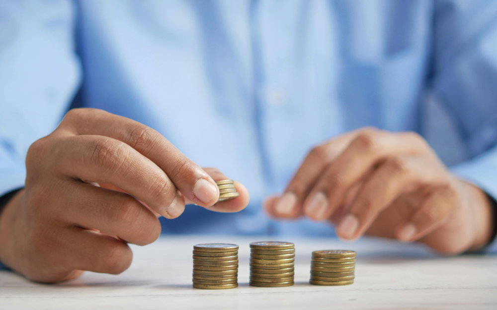 Person Stacking Coin — Midcoast Financial Planning Group in Tuncurry, NSW