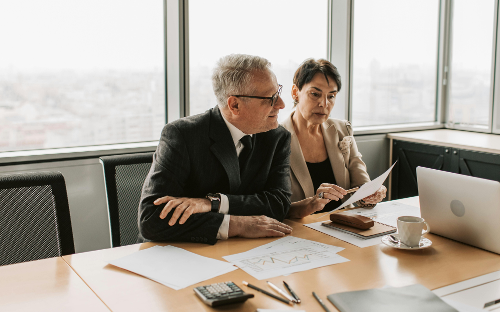 Two People in Suits Review Documents — Midcoast Financial Planning Group in Tuncurry, NSW